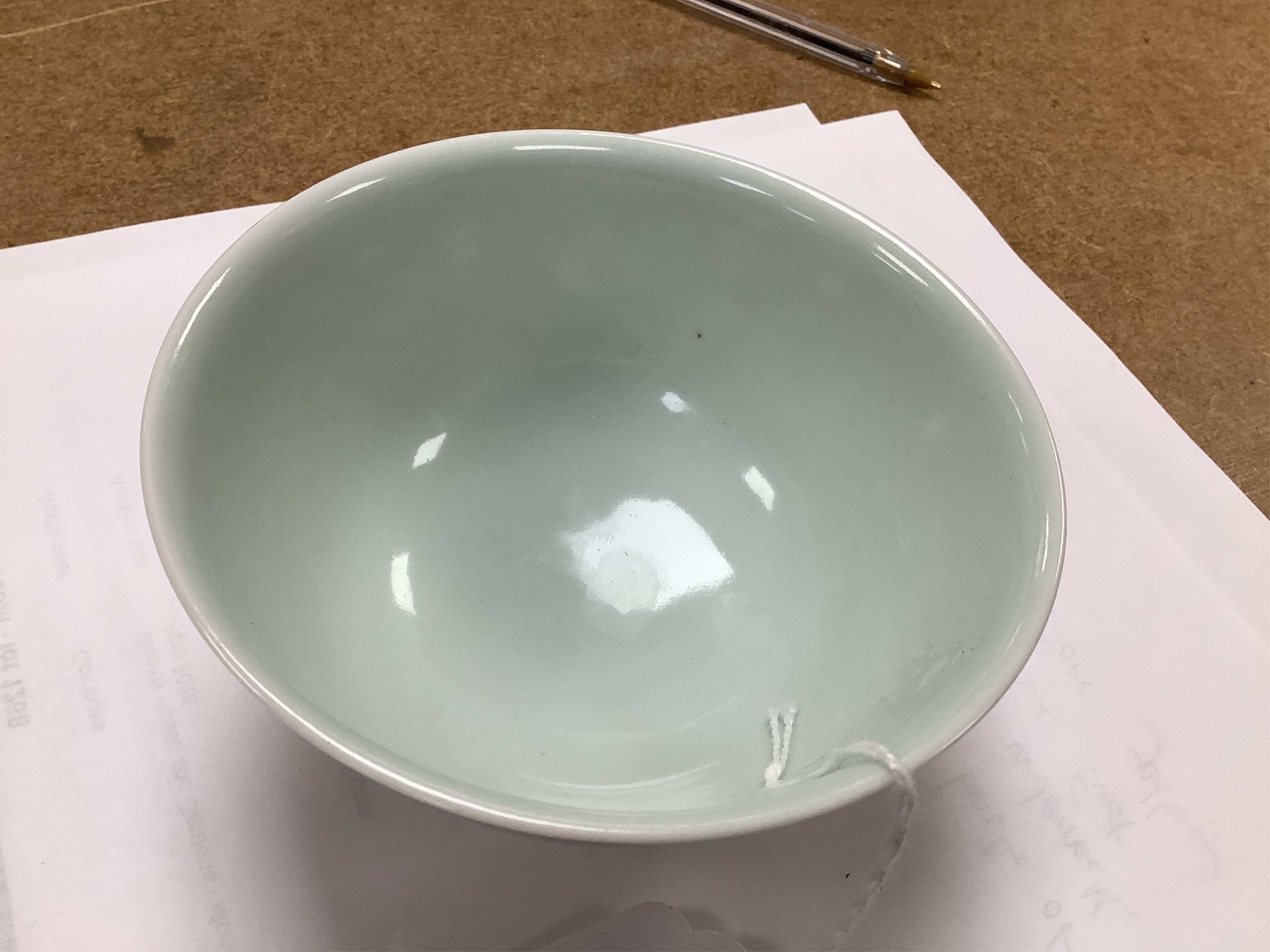 A Chinese underglaze copper red ‘dragon' bowl, Kangxi mark to base but later, 11cm diameter. Condition - good